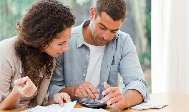 couple-working-with-calculator-1.