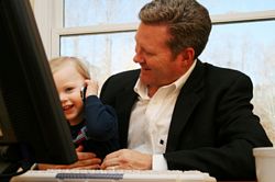father and young son at computer